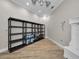 Storage room with ample shelving and light wood floors at 249 Dogwood Trce, Tarpon Springs, FL 34688
