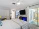 Main bedroom with king bed and access to a patio at 322 Boca Ciega Point N Blvd, St Petersburg, FL 33708