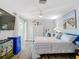 Main bedroom with king-size bed, large TV, and sliding glass doors at 322 Boca Ciega Point N Blvd, St Petersburg, FL 33708