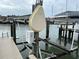 Private boat lift on a wooden dock at 322 Boca Ciega Point N Blvd, St Petersburg, FL 33708