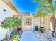 Ornate iron gate opens to a courtyard with plants at 322 Boca Ciega Point N Blvd, St Petersburg, FL 33708