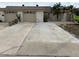 Tan two-car garage, with driveway and landscaping at 322 Boca Ciega Point N Blvd, St Petersburg, FL 33708