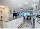 Open concept kitchen with white cabinets and granite countertops at 322 Boca Ciega Point N Blvd, St Petersburg, FL 33708