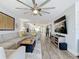 Open living area with sectional sofa and large TV at 322 Boca Ciega Point N Blvd, St Petersburg, FL 33708