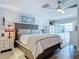 Main bedroom with king-size bed and access to patio at 322 Boca Ciega Point N Blvd, St Petersburg, FL 33708