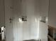 Shower with white tile and small mosaic accents at 322 Boca Ciega Point N Blvd, St Petersburg, FL 33708