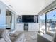 Bright sunroom boasts a built-in entertainment center and comfy seating at 322 Boca Ciega Point N Blvd, St Petersburg, FL 33708