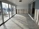Sunroom with tile floors and sliding glass doors, currently under renovation at 322 Boca Ciega Point N Blvd, St Petersburg, FL 33708
