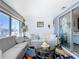 Relaxing sunroom with comfy seating and ocean views at 322 Boca Ciega Point N Blvd, St Petersburg, FL 33708
