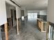 Interior under renovation, showing exposed framing and new flooring at 322 Boca Ciega Point N Blvd, St Petersburg, FL 33708