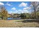 House with a pond view and lush green surroundings at 3332 Vorden St, New Port Richey, FL 34655