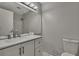 Modern bathroom with double vanity and large mirror at 3332 Vorden St, New Port Richey, FL 34655