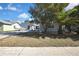 Newly renovated home with a spacious yard and palm tree at 3332 Vorden St, New Port Richey, FL 34655