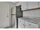 Modern kitchen with stainless steel appliances and white cabinets at 3332 Vorden St, New Port Richey, FL 34655