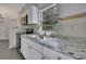 Modern kitchen with white cabinets and granite countertops at 3332 Vorden St, New Port Richey, FL 34655