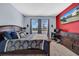 Main bedroom with king-size bed and large windows at 34104 White Fountain Ct, Wesley Chapel, FL 33545