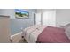 Bedroom with double bed and mounted TV at 34104 White Fountain Ct, Wesley Chapel, FL 33545