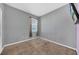 Simple bedroom with carpet flooring and neutral colored walls at 34104 White Fountain Ct, Wesley Chapel, FL 33545