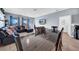 Open dining area with large table and chairs, adjacent to living room at 34104 White Fountain Ct, Wesley Chapel, FL 33545
