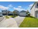 House exterior showcasing a paved driveway and street view at 34104 White Fountain Ct, Wesley Chapel, FL 33545