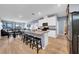 Open concept kitchen with breakfast bar, stainless steel appliances and tile floors at 34104 White Fountain Ct, Wesley Chapel, FL 33545
