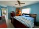 Spacious bedroom with wood flooring and a large bed at 3425 96Th N Ter # 4, Pinellas Park, FL 33782