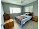 Comfortable bedroom with light walls and ceiling fan at 3425 96Th N Ter # 4, Pinellas Park, FL 33782
