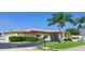Mainlands 4 community building with palm trees and landscaping at 3425 96Th N Ter # 4, Pinellas Park, FL 33782