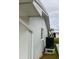 White house exterior showcasing clean lines and AC unit at 3425 96Th N Ter # 4, Pinellas Park, FL 33782