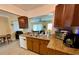 Bright kitchen features granite countertops and ample cabinetry at 3425 96Th N Ter # 4, Pinellas Park, FL 33782
