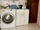 Functional laundry room with washer and dryer at 3425 96Th N Ter # 4, Pinellas Park, FL 33782