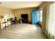 Living room with gray vinyl flooring and a blue door at 3425 96Th N Ter # 4, Pinellas Park, FL 33782
