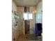 Walk-in shower with marble tile and glass enclosure at 3425 96Th N Ter # 4, Pinellas Park, FL 33782