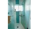 Clean shower with glass enclosure and teal tile at 3425 96Th N Ter # 4, Pinellas Park, FL 33782