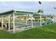 Community shuffleboard courts with covered seating areas at 3425 96Th N Ter # 4, Pinellas Park, FL 33782