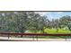 Balcony view overlooking lush green golf course at 36750 Us Highway 19 N # 13301, Palm Harbor, FL 34684