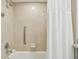 Bathroom with shower/tub combo and white curtain at 36750 Us Highway 19 N # 13301, Palm Harbor, FL 34684