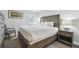 Spacious bedroom with a king-size bed and wood furniture at 36750 Us Highway 19 N # 13301, Palm Harbor, FL 34684