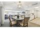 Open concept dining room with kitchen and living room views at 36750 Us Highway 19 N # 13301, Palm Harbor, FL 34684