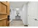 Bright condo entryway with tile flooring, a console table, and neutral walls at 36750 Us Highway 19 N # 13301, Palm Harbor, FL 34684
