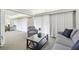 Open concept living room with a view into the dining and kitchen areas at 36750 Us Highway 19 N # 13301, Palm Harbor, FL 34684