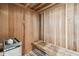 Wood-paneled sauna with bench and stone at 36750 Us Highway 19 N # 13301, Palm Harbor, FL 34684