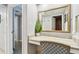 Vanity with mirror and chair, view of hallway at 36750 Us Highway 19 N # 13301, Palm Harbor, FL 34684