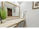 Vanity with a mirror and a chair in the bathroom at 36750 Us Highway 19 N # 13301, Palm Harbor, FL 34684