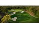 Aerial view of a golf course showcasing its layout and sand traps at 36750 Us Highway 19 N # 15118, Palm Harbor, FL 34684