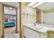 Bathroom with vanity and view into bedroom at 36750 Us Highway 19 N # 15118, Palm Harbor, FL 34684