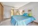 Main bedroom with teal comforter and dresser at 36750 Us Highway 19 N # 15118, Palm Harbor, FL 34684