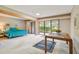 Bedroom with sliding doors to patio, large bed, and table at 36750 Us Highway 19 N # 15118, Palm Harbor, FL 34684