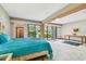 Spacious bedroom with patio access and view of lush greenery at 36750 Us Highway 19 N # 15118, Palm Harbor, FL 34684