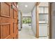 Residential entryway with wood door and view into the living area at 36750 Us Highway 19 N # 15118, Palm Harbor, FL 34684